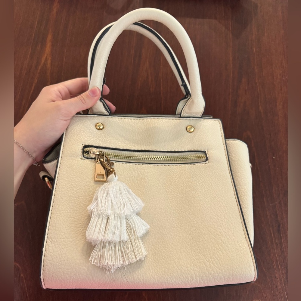 Elegant Cream Handbag with Tassel Accent